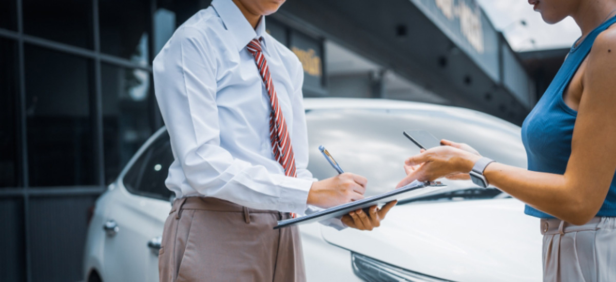 Agent at J. Fox Agency helping a client review their full coverage auto insurance policy and quote in Ohio